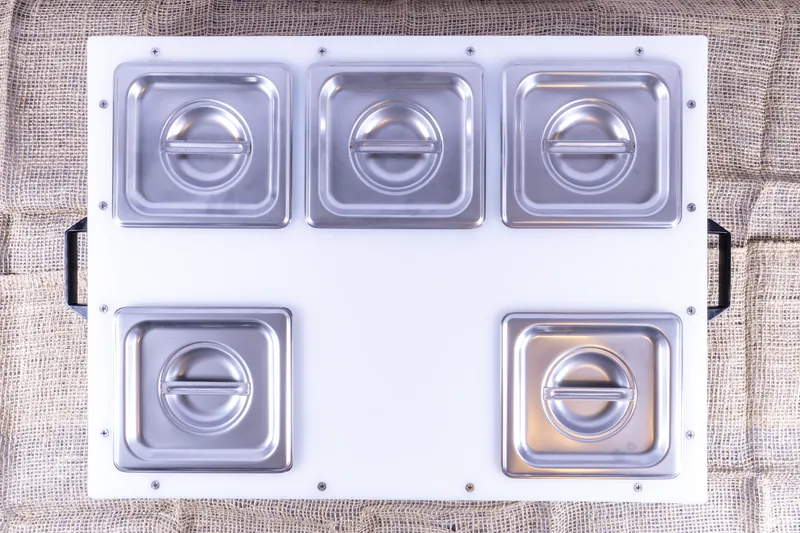 DisplayPrep board with five lidded pans in a custom arrangement
